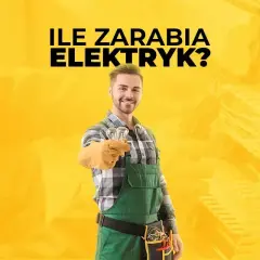 Uśmiechnięty elektryk w zielonym ogrodniczkach trzyma dwie żarówki.