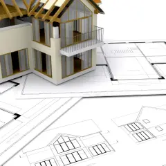 Model domu na planach architektonicznych.