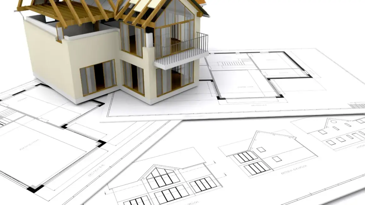 Model domu na planach architektonicznych.